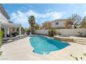 Backyard oasis featuring a sparkling in-ground pool, hot tub, and outdoor lounge area, perfect for entertaining at 6695 Shadow Cove Ave, Las Vegas, NV 89139