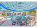 Inviting pool area featuring a shaded dining space, perfect for outdoor entertaining at 6965 S Valley View Blvd, Las Vegas, NV 89118