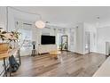 Bright living room with hardwood floors, modern lighting, and large windows providing natural light at 7304 N Decatur Blvd # 6, North Las Vegas, NV 89131