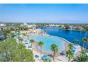 Stunning aerial view of a community lagoon with sandy beaches and resort-style amenities at 8100 Lake Hills Dr, Las Vegas, NV 89128