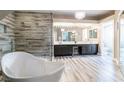 Luxurious primary bathroom with a soaking tub, a separate shower, and dual vanities at 8100 Lake Hills Dr, Las Vegas, NV 89128