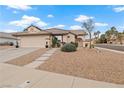 Charming single-story home with a tile roof, low-maintenance desert landscaping, and an attached two-car garage at 845 Holly Lake Way, Henderson, NV 89002