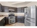 Bright kitchen featuring stainless steel appliances, a double oven, and ample cabinet space for storage at 845 Holly Lake Way, Henderson, NV 89002