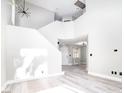 Open-concept living room with hardwood floors and lots of natural light at 1216 Padre Serra Ln, Las Vegas, NV 89134