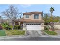 Charming two-story home featuring a well-maintained yard, tile roof, and attached two-car garage at 1800 Montvale Ct, Las Vegas, NV 89134