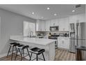 Stylish kitchen features white cabinets, quartz countertops, and stainless steel appliances at 1800 Montvale Ct, Las Vegas, NV 89134