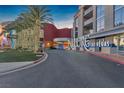 Elegant Allure Las Vegas entrance with manicured landscaping, mature palm trees and circular driveway at 200 W Sahara Ave # 801, Las Vegas, NV 89102