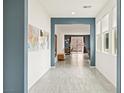 Inviting hallway with tiled floors leading to the open living spaces at 2150 Grant Union Ct, Laughlin, NV 89029