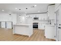 Modern kitchen with a center island, pendant lighting, and stainless steel appliances at 2521 Richfield Blvd, Las Vegas, NV 89102