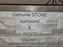 Close up of a stacked stone fireplace surround and wood mantel at 2844 Alenga St, Henderson, NV 89044