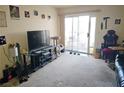 Relaxed living room with a sliding door to a patio and space for entertainment at 3550 Bay Sands Dr # 3056, Laughlin, NV 89029