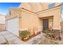 Two story home featuring desert landscaping, concrete driveway and an attached two car garage at 3626 Gold Sluice Ave, North Las Vegas, NV 89032