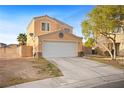 Two story home featuring desert landscaping, concrete driveway and an attached two car garage at 3626 Gold Sluice Ave, North Las Vegas, NV 89032