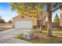 Two story home featuring desert landscaping, concrete driveway and an attached two car garage at 3626 Gold Sluice Ave, North Las Vegas, NV 89032