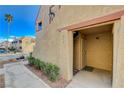 Exterior entrance of the condo unit displaying the unit number with well-kept desert landscaping at 4140 Gannet Cir # 255, Las Vegas, NV 89103