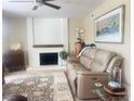 Comfortable living room features a cozy fireplace, plush seating, and stylish decor at 4194 Greenpoint St, Las Vegas, NV 89147