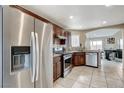 Updated kitchen featuring stainless steel appliances and tile backsplash at 4977 Vacaville Ave, Las Vegas, NV 89139