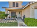 Charming home featuring a quaint front entrance with desert landscaping and stone planter at 525 Sunnys Halo Ct, Henderson, NV 89015