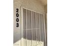 Security screen on building exterior with unit number at 5710 E Tropicana Ave # 2003, Las Vegas, NV 89122
