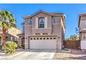 Charming home features a well-manicured yard and an attached two-car garage at 6472 Chebec St, North Las Vegas, NV 89084