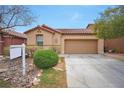Charming single-story home with desert landscaping and a two-car garage at 7317 Caballo Range Ave, Las Vegas, NV 89179