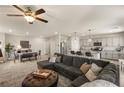 Inviting living room showcasing an open floor plan, modern decor, and stylish furnishings at 7717 Rosebark Cliffs St, North Las Vegas, NV 89084