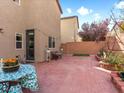 Inviting backyard patio showcasing brick pavers, a seating area, and a well-manicured garden, ideal for entertaining at 8248 Southern Cross Ave, Las Vegas, NV 89131