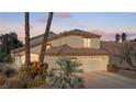 Charming home featuring a three-car garage and landscaped front yard at 8432 Squaw Valley Ave, Las Vegas, NV 89128