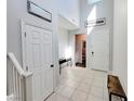 Bright entryway with tiled floors, two doors, and console table at 10819 Far Country Ave, Las Vegas, NV 89129