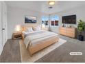 Stylish main bedroom with ample natural light, featuring modern furniture and a serene atmosphere at 1200 Cunningham Dr, Las Vegas, NV 89106