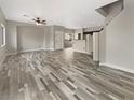 Spacious living room showcasing hardwood floors and staircase at 1578 Ward Frontier Ln, Henderson, NV 89002
