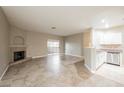 Neutral living area with fireplace, and sliding doors to patio at 2050 W Warm Springs Rd # 4322, Henderson, NV 89014