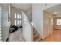 Inviting entryway with soaring ceilings, staircase, and views into the living room at 3747 Gulliver St, Las Vegas, NV 89115