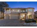 Grand two-story home with a three-car garage, manicured landscaping, and a spacious front yard at 4339 Grey Spencer Dr, Las Vegas, NV 89141