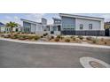 Beautiful single-story home boasts a modern design with xeriscaping and a sleek black gated courtyard at 4345 N Dapple Gray Rd, Las Vegas, NV 89129