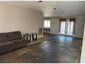 Spacious living room with a large window and glass doors leading outside at 4442 Bennett Dr, Las Vegas, NV 89121