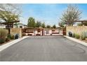 Gated entrance with decorative metal work and stone pillars at 4560 E Cactus Canyon Dr, Pahrump, NV 89061
