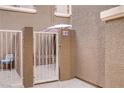 Private courtyard access through a decorative metal gate at 5465 Cardinal Ridge Ct # 103, Las Vegas, NV 89149