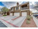Stylish multi-story townhome with a quaint balcony and attached garages at 5465 Cardinal Ridge Ct # 103, Las Vegas, NV 89149