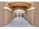 A stone walkway leads to a gated courtyard at 5465 Cardinal Ridge Ct # 103, Las Vegas, NV 89149