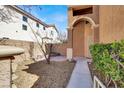 Covered front porch with desert landscaping at 7156 N Campbell Rd, Las Vegas, NV 89149