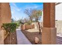 Pathway to the front door, surrounded by desert landscaping at 7156 N Campbell Rd, Las Vegas, NV 89149