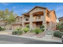 Charming two-story home with a private balcony, manicured landscaping, and neutral color palette at 8093 Luna Sera Ave, Las Vegas, NV 89178