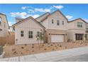 Charming two-story home featuring a neutral exterior, brick driveway, complemented by a well-manicured landscape at 8979 Rolling Pietra St, Las Vegas, NV 89166