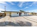 Single-story home featuring a minimalist front yard with a gravel landscape, walkway, and driveway at 1225 Arrowhead Ave, Las Vegas, NV 89106