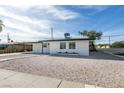Single-story home featuring a minimalist front yard with a gravel landscape and walkway at 1225 Arrowhead Ave, Las Vegas, NV 89106