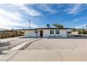 Charming single-story home featuring a low-maintenance front yard with gravel and a walkway at 1225 Arrowhead Ave, Las Vegas, NV 89106
