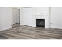 Living room featuring a fireplace and luxury vinyl plank flooring at 1624 N Torrey Pines Dr # 101, Las Vegas, NV 89108