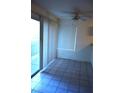 Dining area with sliding glass doors, a ceiling fan, and tiled floors at 2121 Sealion Dr # 105, Las Vegas, NV 89128
