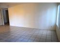 A bright and airy living room featuring tiled floors and neutral walls at 2121 Sealion Dr # 105, Las Vegas, NV 89128